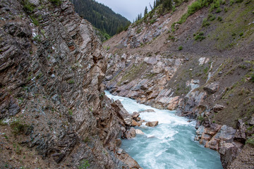 Top view of the Naryn River flowing through a mountain gorge