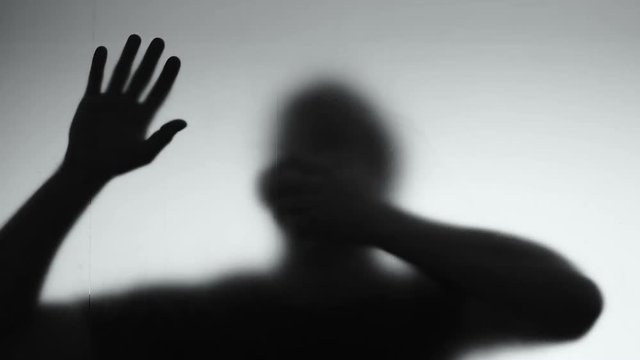 Male shadow suffocating gas trying to find exit, asphyxiation hopelessness