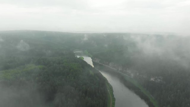 morning clouds over the forest and over the Chusovaya River