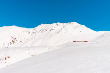 The japan alps  Tateyama Kurobe alpine  in sunshine day with  blue sky background is one of the most important and popular natural place in Toyama Prefecture, Japan.