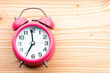 alarm clock on wooden background