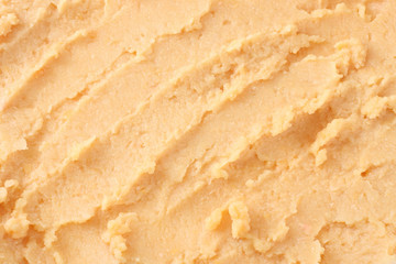 chickpea hummus background. mashed chickpea texture. top view