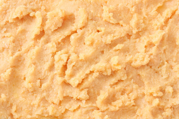 chickpea hummus background. mashed chickpea texture. top view