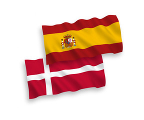 Fototapeta premium National vector fabric wave flags of Denmark and Spain isolated on white background. 1 to 2 proportion.