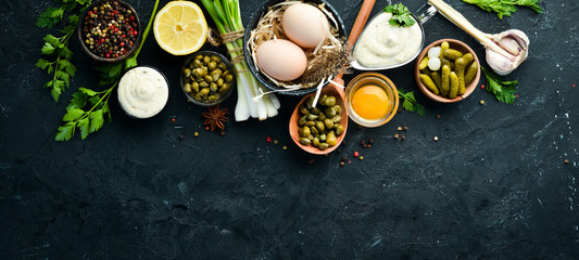 Tartar sauce. Making sauce from capers, cucumbers, parsley, lemon and eggs. Top view. free space...