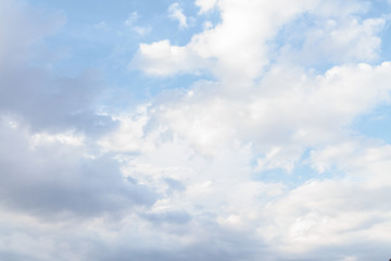 White fluffy clouds in the blue sky in summer