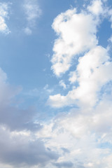 White fluffy clouds in the blue sky in summer