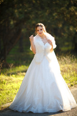 Fototapeta na wymiar Beautiful bride in gorgeous wedding dress