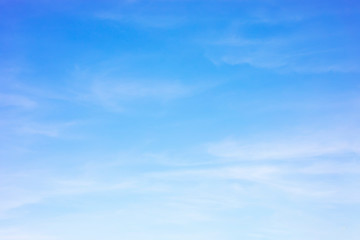 Blue sky background and white clouds soft focus, and copy space