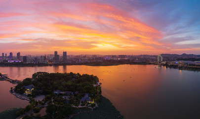 Beautiful sunset glow over Xuanwu Lake in Nanjing city taken with a drone flying in the air.