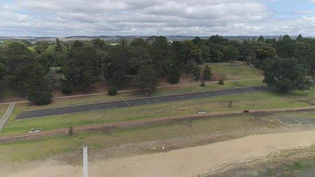 drone over town road and lake