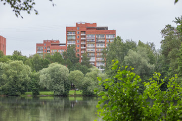 Fototapeta na wymiar City Riga, Latvia Republic. Apartment house and nature. Riga neighborhood. Juny 29. 2019 Travel photo.