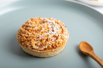 homemade cake with whipped cream and crushed nuts