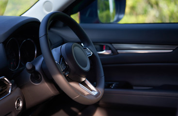 Vehicle interior of a modern car with steering wheel