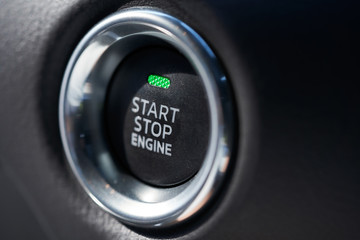 Closeup of a modern car interior with Start Stop engine button