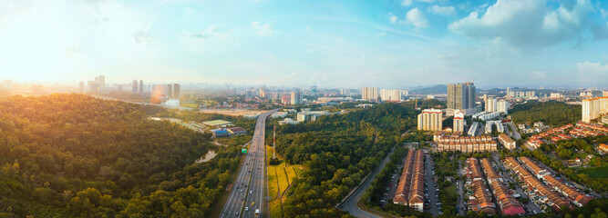 Panorama wide angle view cityscape,green park,terrace house and highway located at Kuala...