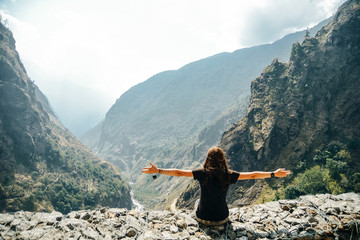 Hiking in Himalaya. Woman Traveler in the Mountains