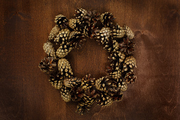 Pine cones on old wooden table flat lay