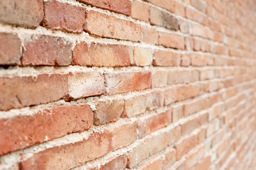 Old red brick wall background with  perspective