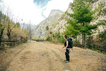 Hiking in Himalaya. Woman Traveler in the Mountains