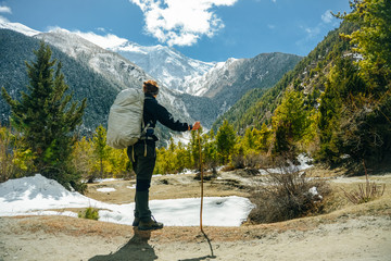 Hiking in Himalaya. Woman Traveler in the Mountains