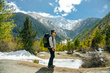 Hiking in Himalaya. Woman Traveler in the Mountains