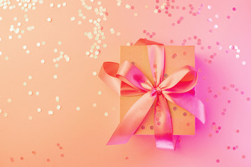 Christmas, birthday, wedding neon card with gift box bow on pink and  background