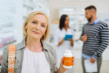 Cheerful senior woman demonstrating her personal choice