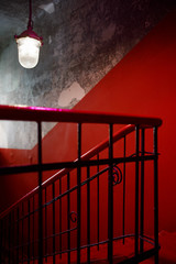 Entrance hall with red walls and stairs