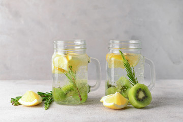Mason jars of infused water on table