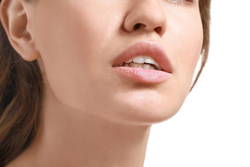 Obraz premium Young woman with beautiful lips on white background, closeup
