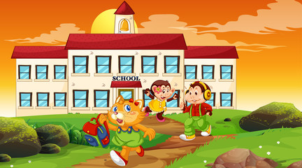 Happy children infront of school building