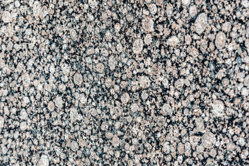 Close up of a gray granite wal tevture - image