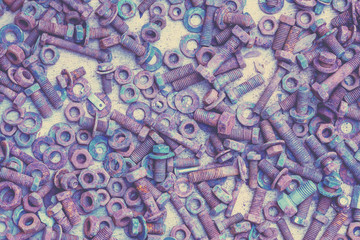 Abstract grunge metal background from old rusty bolts, screws, nuts and washers
