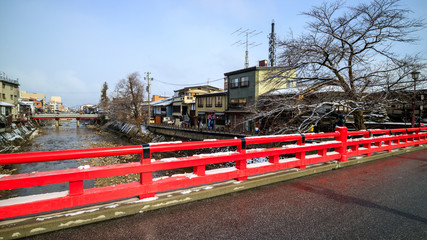 Nakabashi bridge and canal in Takayama in winter with snow