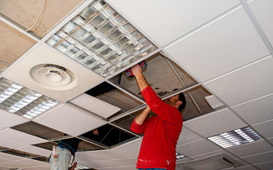 Suspended ceiling with drywall and fixing the drywall to the ceiling metal frame.
