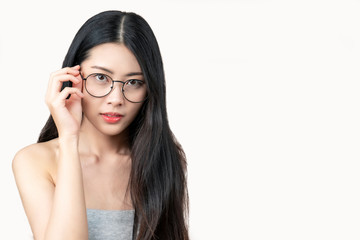 Pretty attractive  Asian woman holding her glasses. White background.