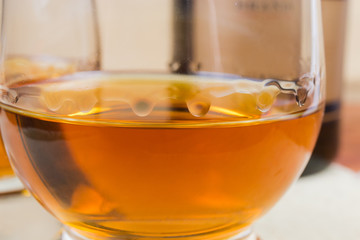 Brandy in glass close-up in selective focus