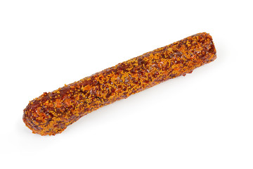 Whole salami covered with French mustard on a white background