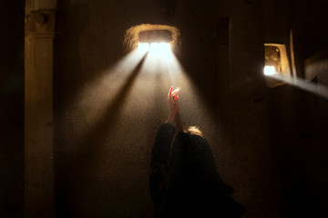 Hand reaching to light, Surreal - Ancient