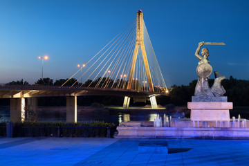 Mermaid and Swietokrzyski Bridge In Warsaw At Night