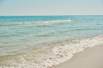 View of beach and sea, blue water. Tourism and vacation on ocean. Family vacation in summer. Vacation at sea . Summer travel.