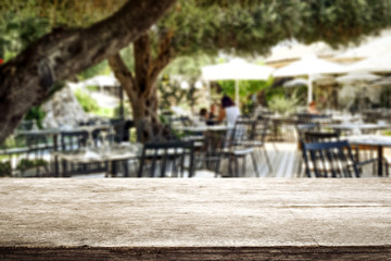 Desk of free space and blurred background of restaurant 