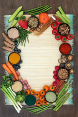 Fototapeta na wymiar Liver detox diet health food concept with fresh fruit, vegetables, herbs, spices, dietary supplements and herbal medicine. Foods high in antioxidants, anthocaynins, vitamins & dietary fibre. Top view.