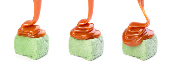 Marshmallow poured with caramel on a white background