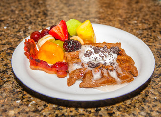 american breakfast with meat and fresh fruits on a plate