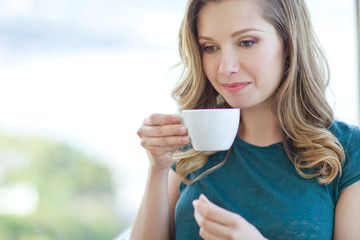 Woman drinking coffee. 