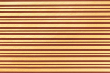 Light brown and golden background from wrapping striped paper.