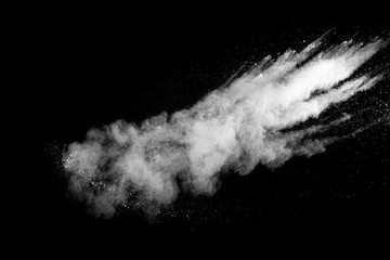 White talcume powder explosion on black background. White dust splashing.