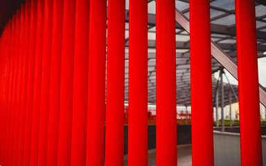 red facade of the building made of metal strips